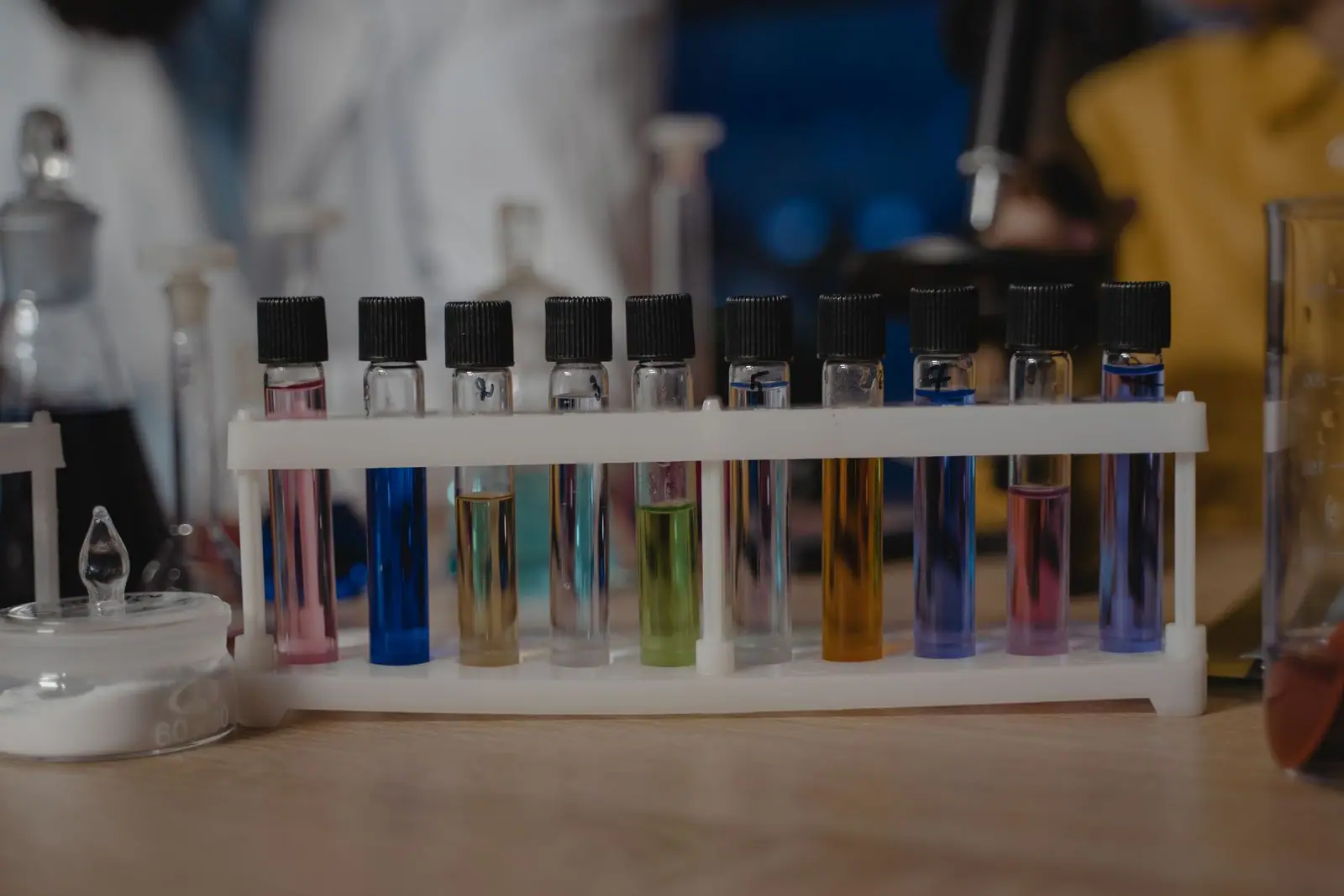 Test tubes of colored liquid in a rack
